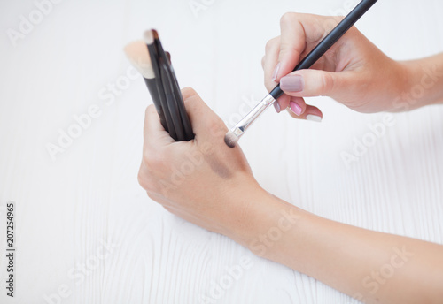 Eye shadow with brush on white background.