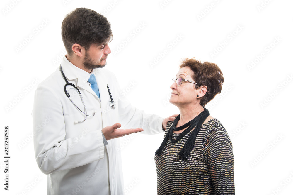 Male doctor explaining something to female senior patient Male doctor explaining something to female senior patient