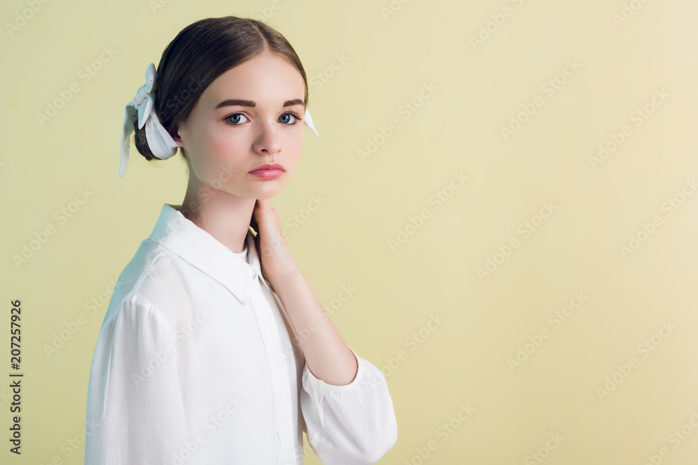 styling teen girl posing in white outfit, isolated on yellow styling teen girl posing in white outfit, isolated on yellow