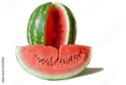 cut red watermelon with a separate slice on a white background