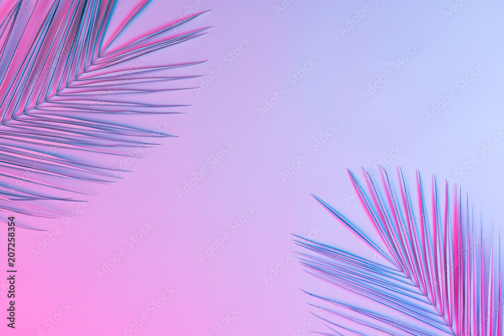 Fototapeta Tropical and palm leaves in vibrant bold gradient holographic neon colors. Concept art. Minimal surrealism background.