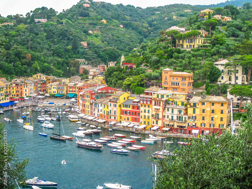 Aerial view of Portofino, a famous vacation resort with a picturesque harbor, luxury yachts and celebrity. Italian fishing village, provinces Genoa, Italy.