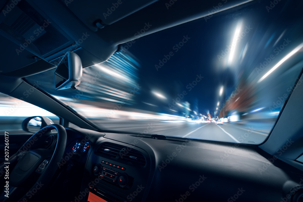 Car speed drive on the road in night city