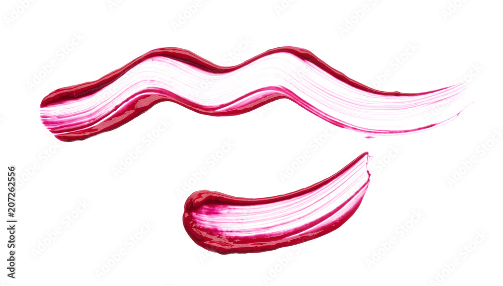 Red makeup smear of creamy lip gloss Red makeup smear of creamy lip gloss