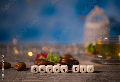 Congratulation HAPPY EID composed of wooden dices photo