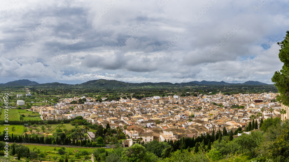 Mallorca, XXL panoramic view over ancient old town of Arta between green mountains