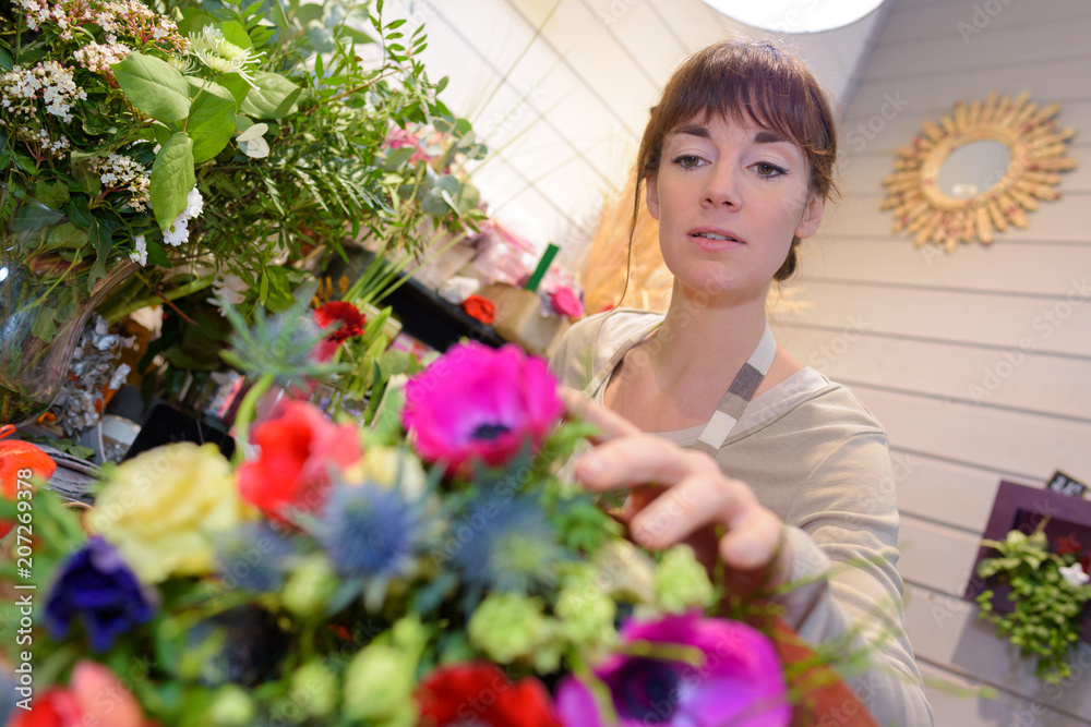 female florist taking a flower