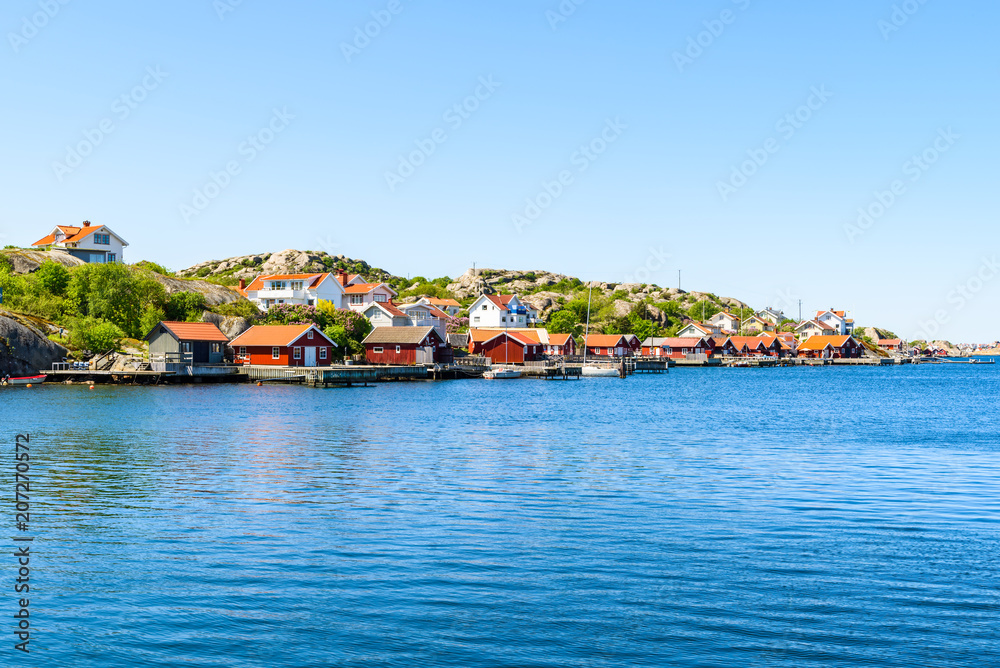 The coastal village of Storkalv, seen from across the sound Kalvesund outside Ronnang on Tjorn, Sweden.