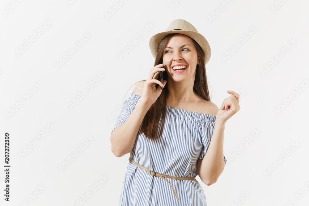 Smiling woman dressed blue dress, hat talking on mobile phone, conducting pleasant conversation isolated on white background. People, sincere emotions, lifestyle concept. Advertising area. Copy space.