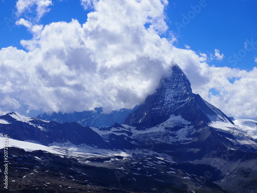 Wonderful Matterhorn mount in clouds, alpine mountains range landscape in swiss Alps seen from Gornergrat in SWITZERLAND
