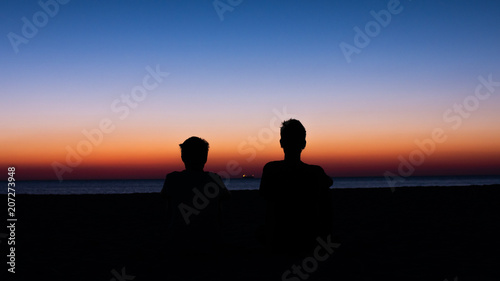 Friends watching the sunset