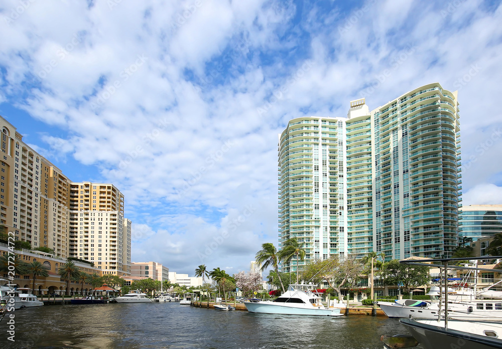 Beautiful buildings, water and boats spanning the north and south banks of Fort Lauderdale's New River.