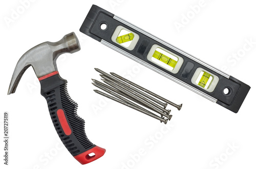 Schilderij op canvas Spirit level, hammer and nails on white