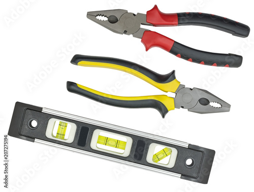 Schilderij op canvas Spirit level and pliers on white