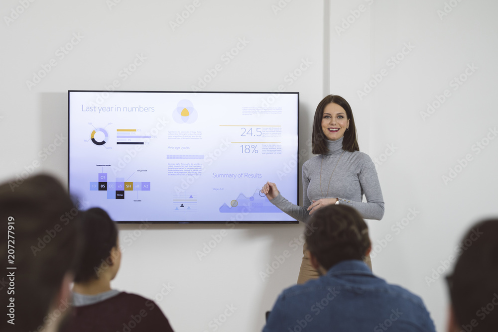 Woman Giving Lecture in Office
