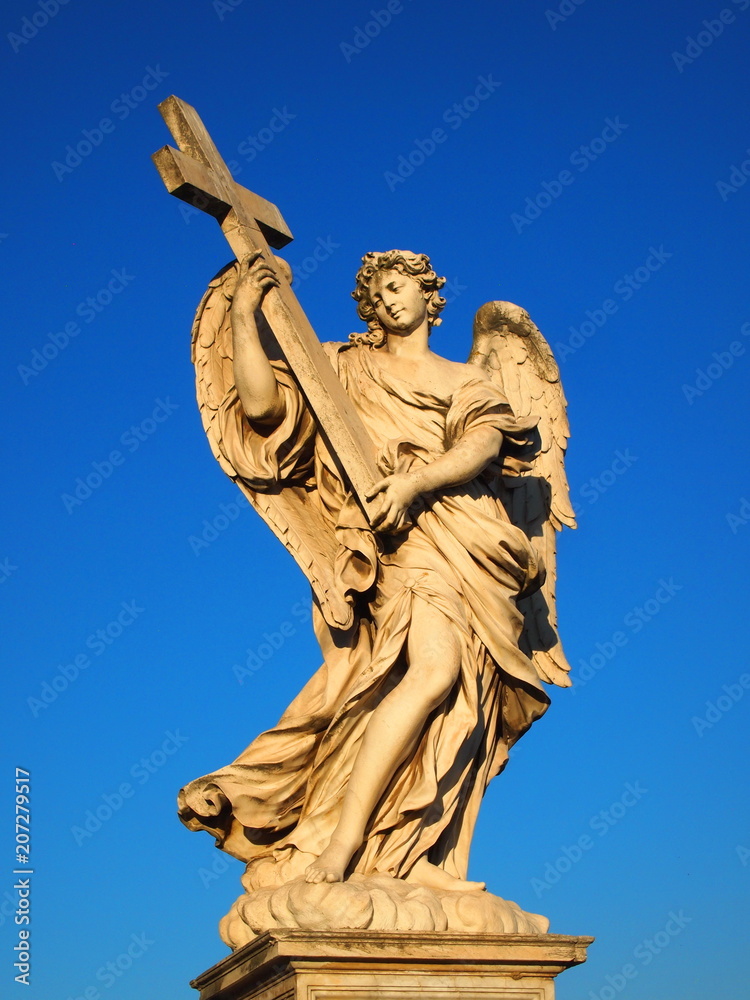  Marble statue of angel with cross from the Sant'Angelo Bridge in Rome, Italy