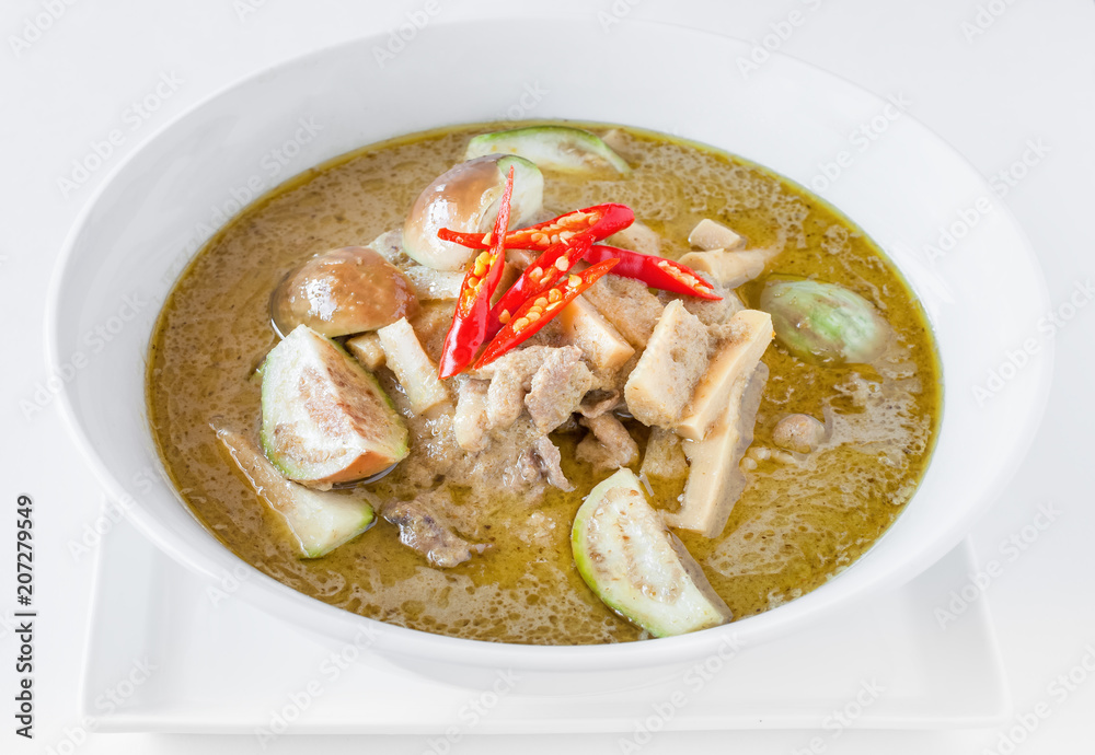 Green chicken curry with eggplant and pickled bamboo shoot. Green curry is a Central Thai variety of curry Green chicken curry with eggplant and pickled bamboo shoot. Green curry is a Central Thai variety of curry