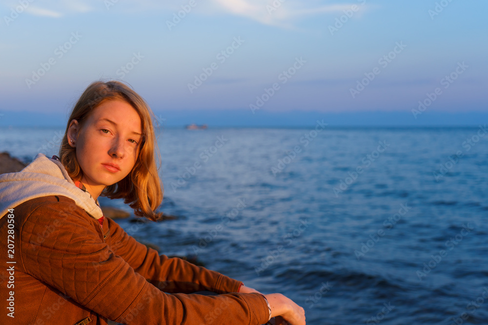 Portrait of young beautiful lady admiring the summer landscape o Portrait of young beautiful lady admiring the summer landscape o