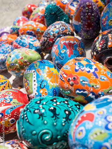 Colorful ceramic handmade eggs on street turkish market
