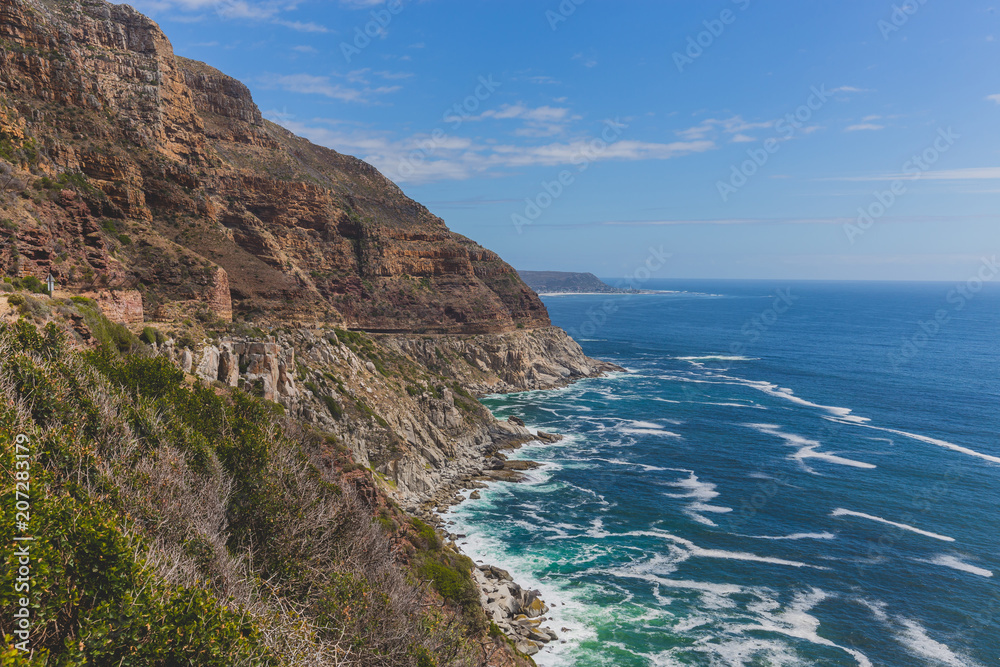 Chapman's Peak Drive along rocky coastal landscape in Cape Town Chapman's Peak Drive along rocky coastal landscape in Cape Town