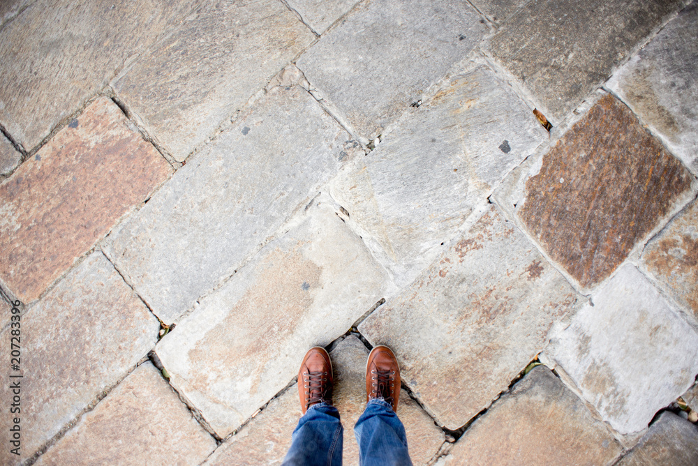 Feet on Granite Floor Texture Background.