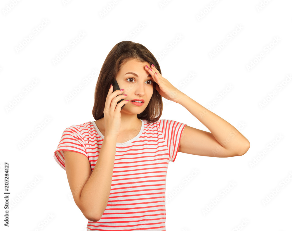 girl talking on a mobile phone misunderstanding and keeps his hand on his head. emotional girl isolated on white background girl talking on a mobile phone misunderstanding and keeps his hand on his head. emotional girl isolated on white background