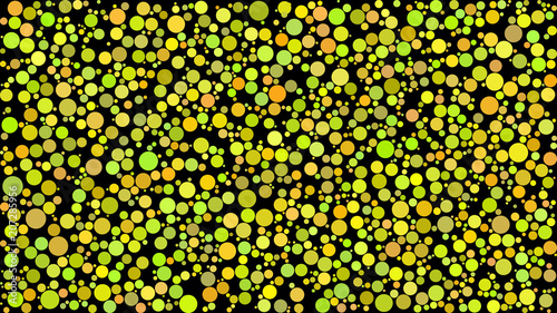 Abstract background of circles of different sizes in shades of yellow colors on black background.