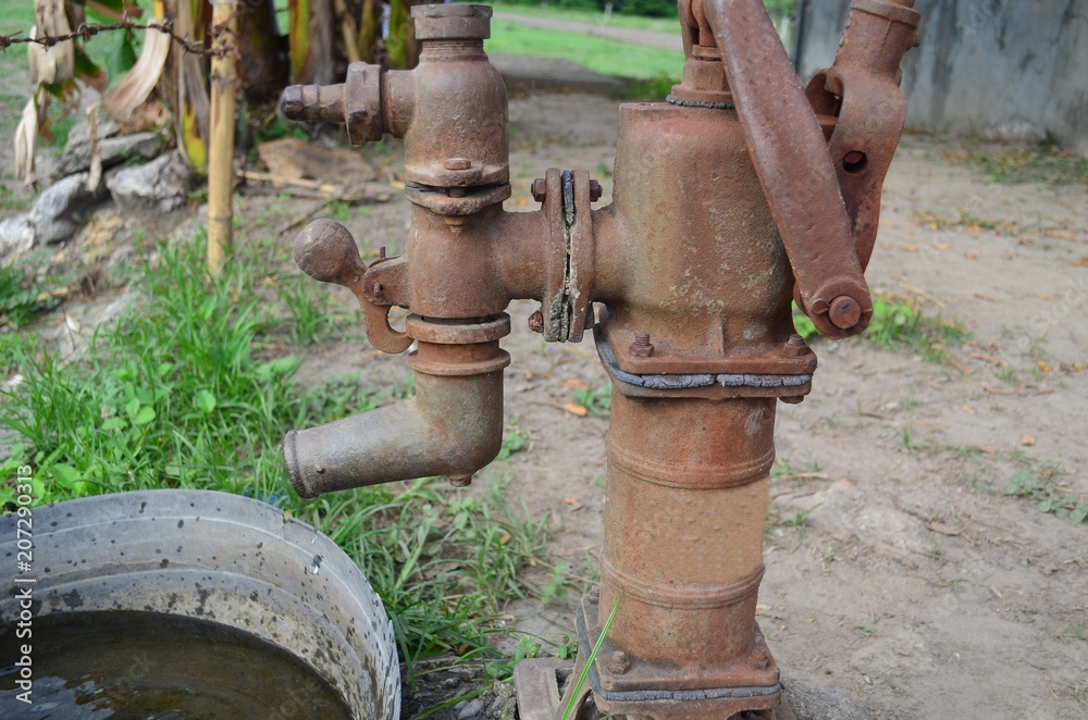 Vintage hand water pump in a small village in Central Luzon, Philippines.  Photos