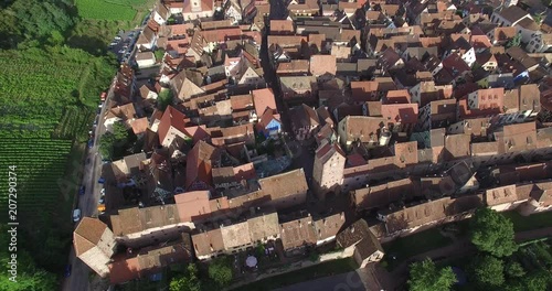 OVER RIQUEWIHR VILLAGE. ROMANTIC ALSACE IN FRANCE VINEYARD REGIO. 4K DRONE FOOTAGE.