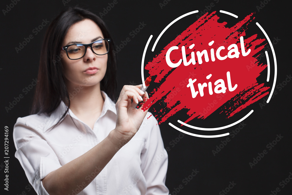 The concept of marketing, technology, the Internet and the network. A young businessman shows what is important for business: Clinical trial The concept of marketing, technology, the Internet and the network. A young businessman shows what is important for business: Clinical trial