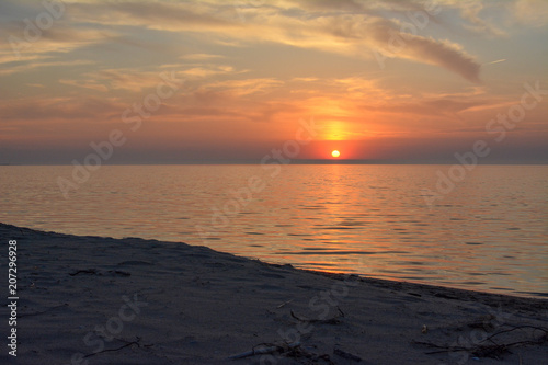 Lake Michigan sunset over a sandy beach