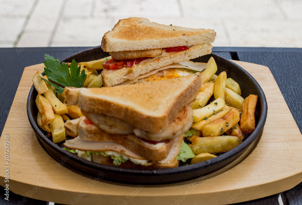 Chicken sandwich in toast bread, with French fries as a bowl, on a white background, restaurant, served Chicken sandwich in toast bread, with French fries as a bowl, on a white background, restaurant, served
