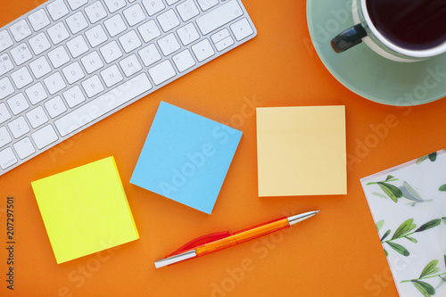 Set of colorful stickers, white keyboard, notebook and snacks. Office table, desk with different objects. Working process. Education, business concept.