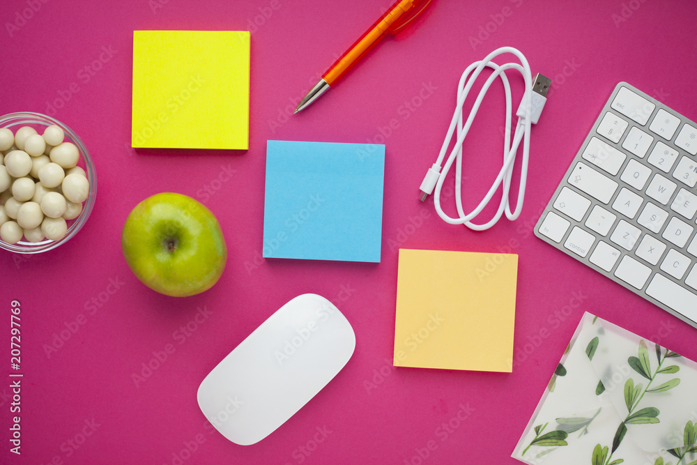 Set of colorful stickers, white keyboard, notebook and snacks. Office table, desk with different objects. Working process. Education, business concept. Set of colorful stickers, white keyboard, notebook and snacks. Office table, desk with different objects. Working process. Education, business concept.
