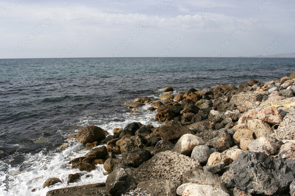 The stone coast of the Mediterranean sea on the sunny day