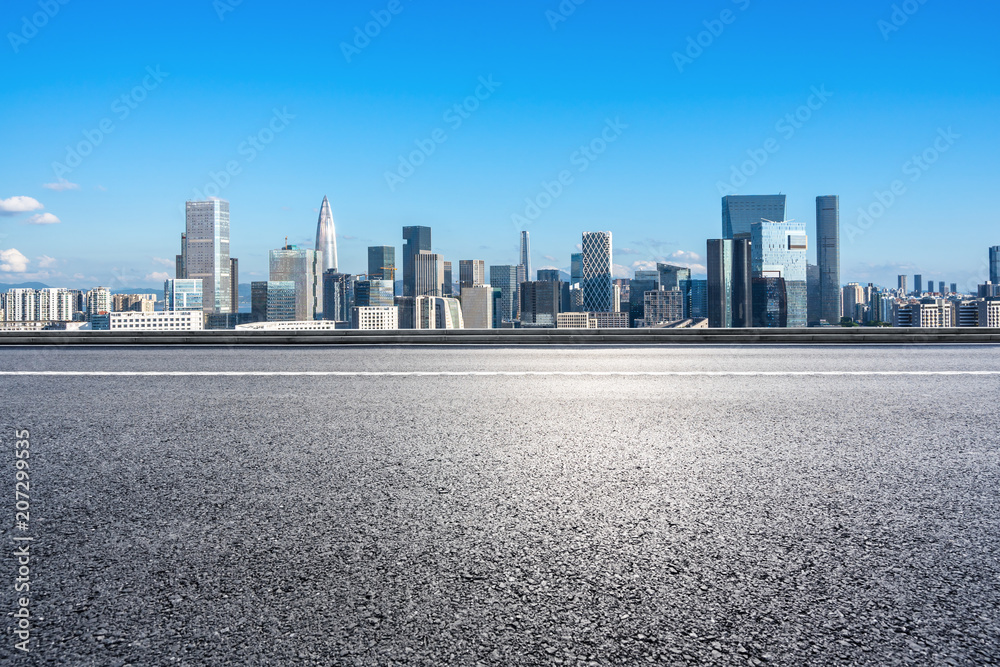 city skyline with empty asphalt road in urban city skyline with empty asphalt road in urban