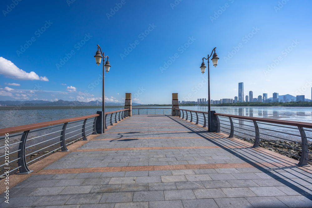 city skyline with empty floor in urban square city skyline with empty floor in urban square