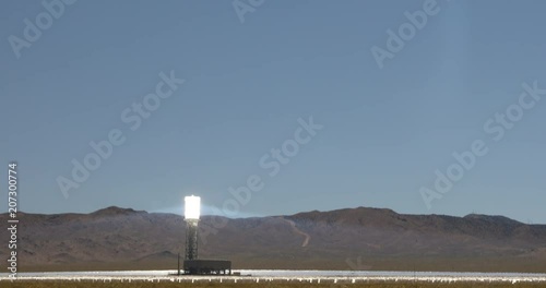 Sunlight is directed at a solar electric energy generating system thermal plant in the Mojave Desert photo