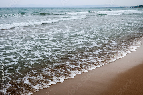 A beach and blue / turquois...