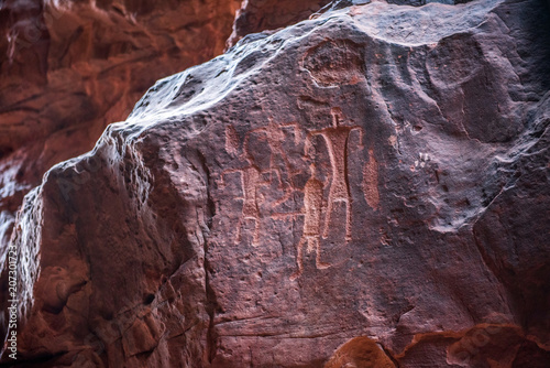 Nabatean and Thamudic inscriptions on rock in Wadi Rum desert photo