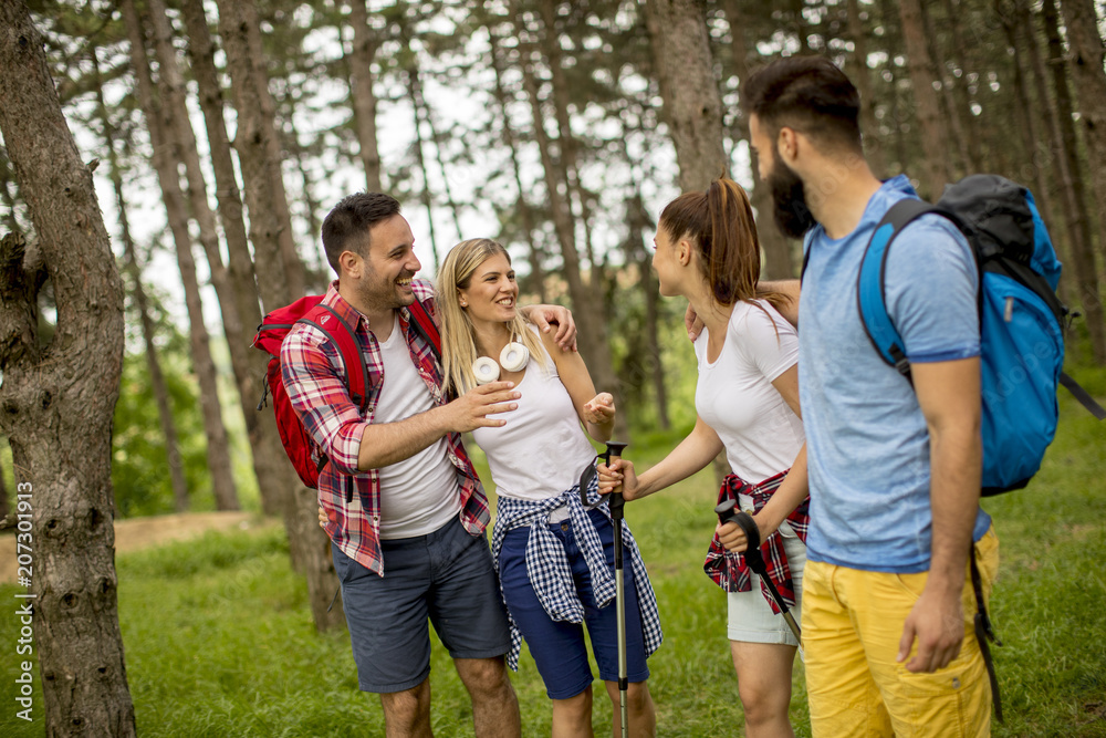 Group of young people are hiking in mountain Group of young people are hiking in mountain