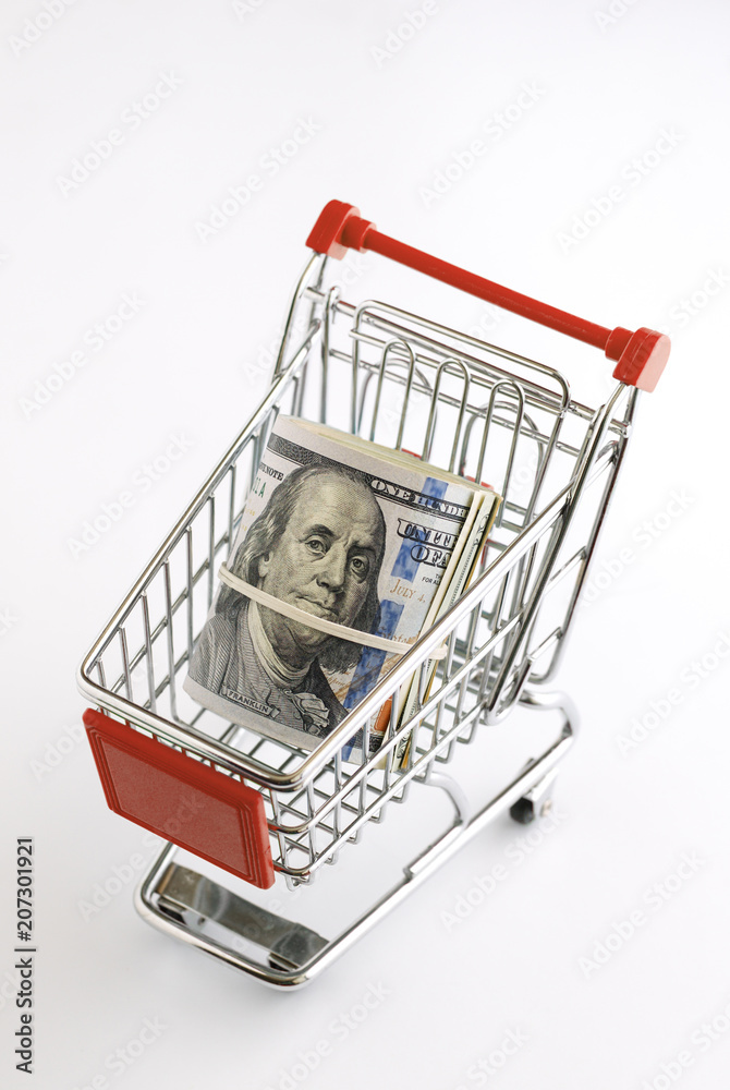 The supermarket cart is filled with American dollars