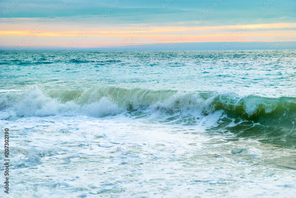 Sea landscape with big waves and sunset Sea landscape with big waves and sunset