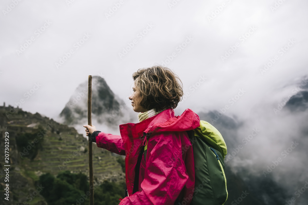 Naklejka premium Young woman at Machu Picchu in Peru
