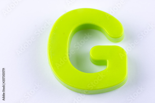 letter G uppercase alphabet isolated made of plastic on white background with shadows