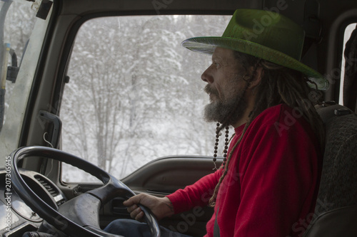 Russian trucker driving his truck.
