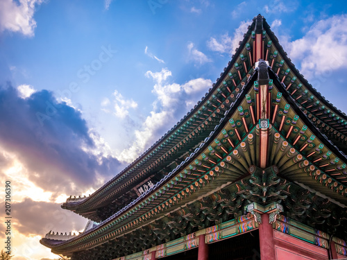  The main gate at Changdeokgung Palace sunshine lighting blue sky is a famous tourist attraction in Seoul, South Korea.
