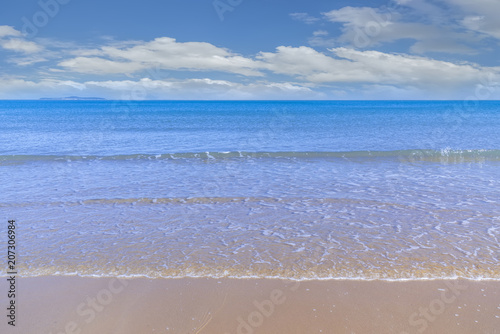 Sea beaches under the blue sky and white clouds photo