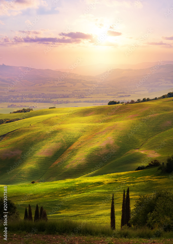 Italy; San Quirico d'Orcia; sunset over Tuscan Valdorcia rolling hills