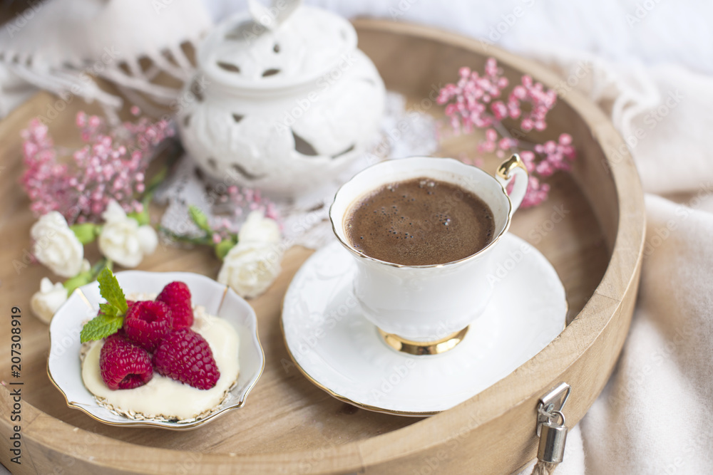 Morning fragrant coffee in a white cup and sweet breakfast with berries. Vintage photo Morning fragrant coffee in a white cup and sweet breakfast with berries. Vintage photo